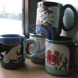 puodukai su zodiako ženklais